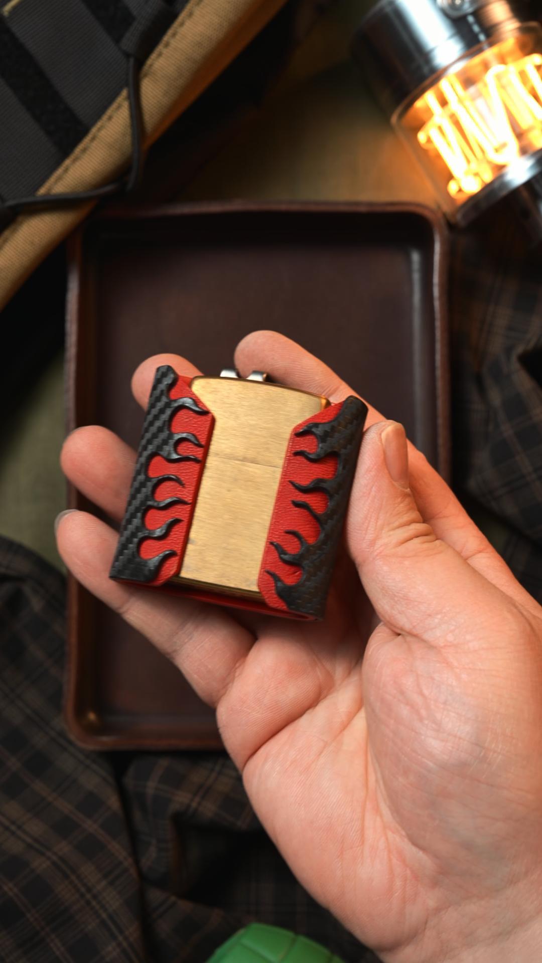 Zippo shark sheath held in hand with lighter partially removed