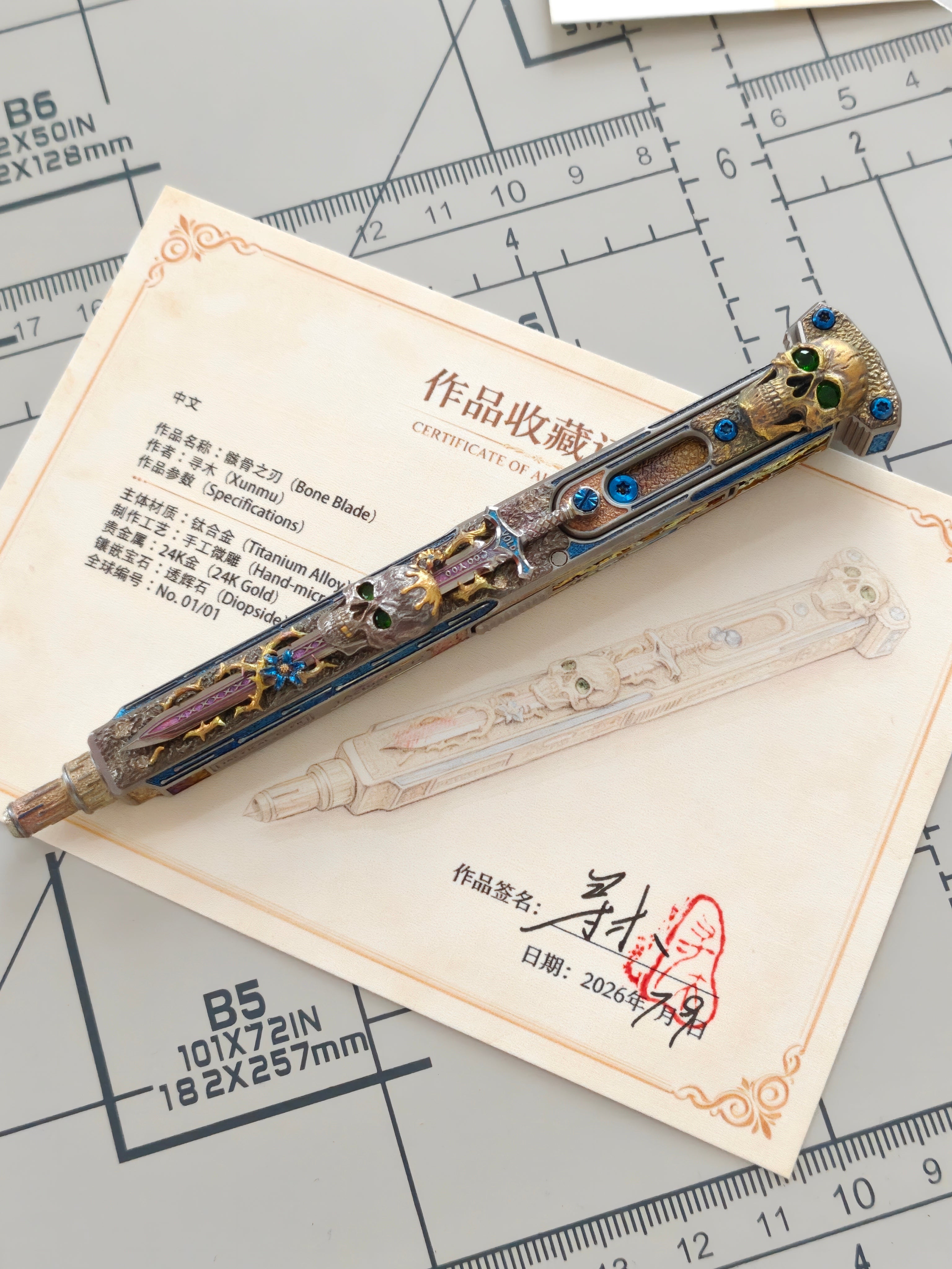 Blade of Bones one-off engraved EDC pen displayed with artist certificate