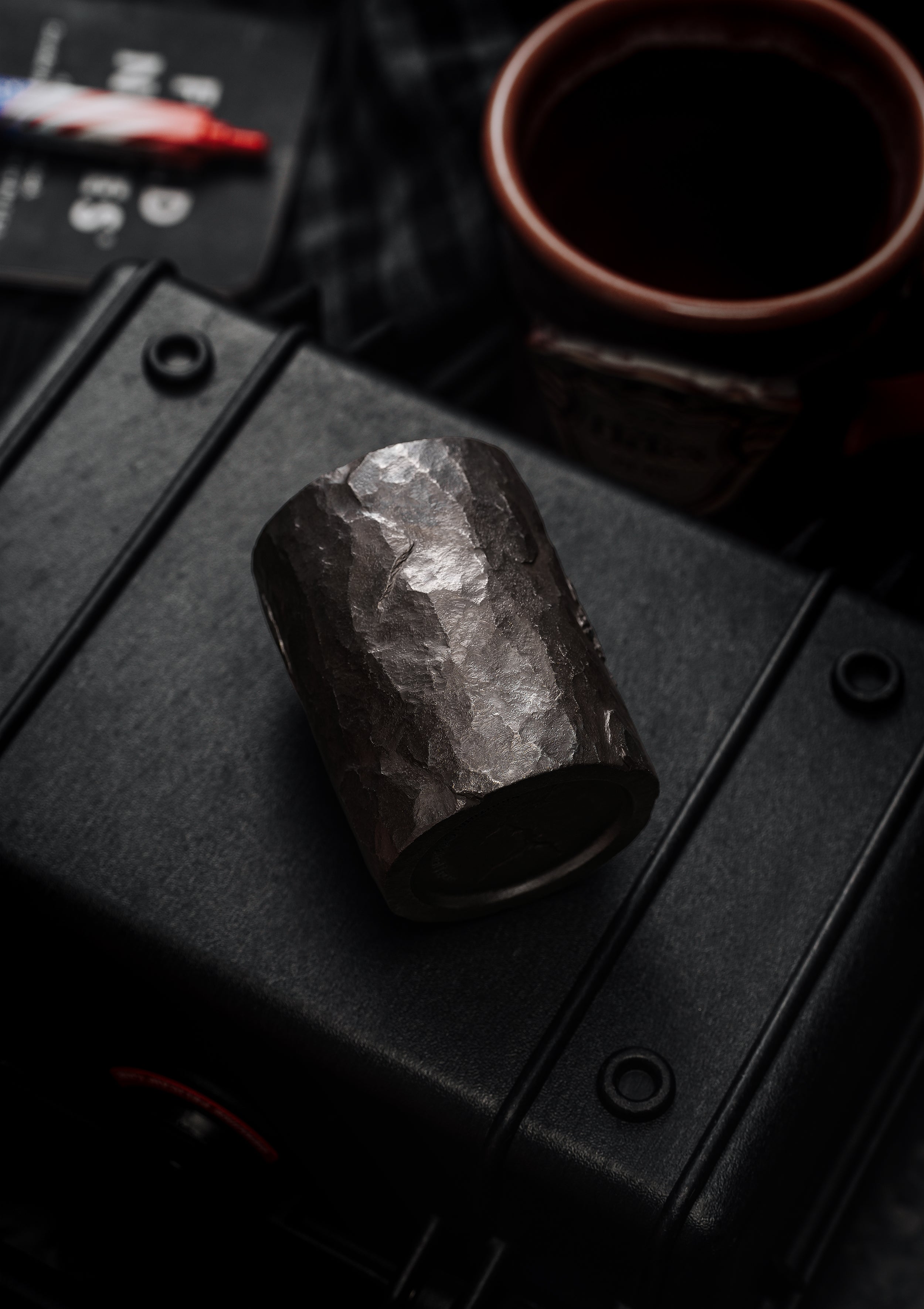 TacticalGeek_x_Sunizumi_One-Off_Hand-Carved_Titanium_Sake_Cup_Stone-Texture_Stegosaurus-5