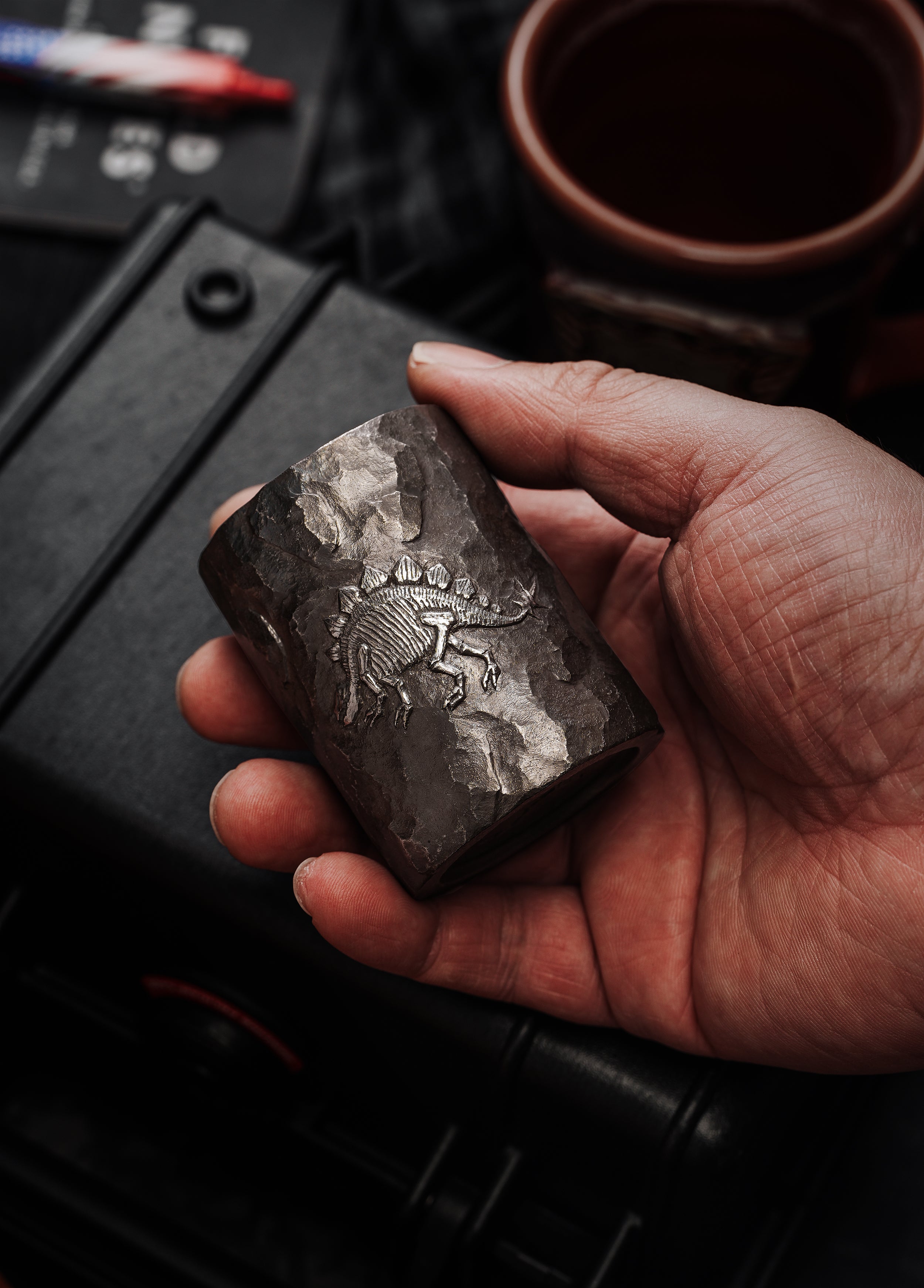 TacticalGeek x Sunizumi One-Off Hand-Carved Titanium Sake Cup: "Stone-Texture Stegosaurus"